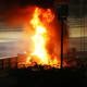 Illustration for article titled Haas Driver Romain Grosjeans F1 Car Goes Up In Flames, Spears Through Barrier, Splits In Half. Grosjean Walks Away